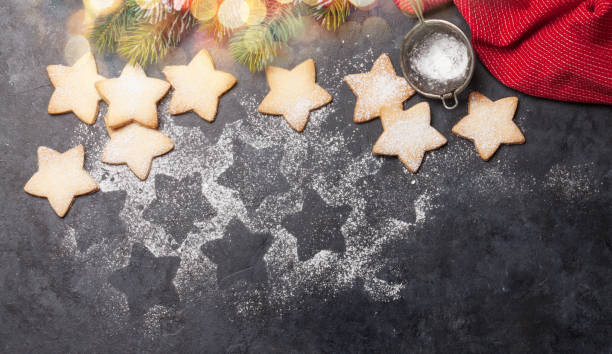 istock Christmas greeting card with fir tree and gingerbread cookies 1280109817