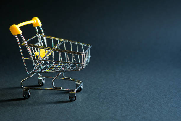 istock Empty grocery cart from a supermarket on a black background. Black Friday, 1280111066