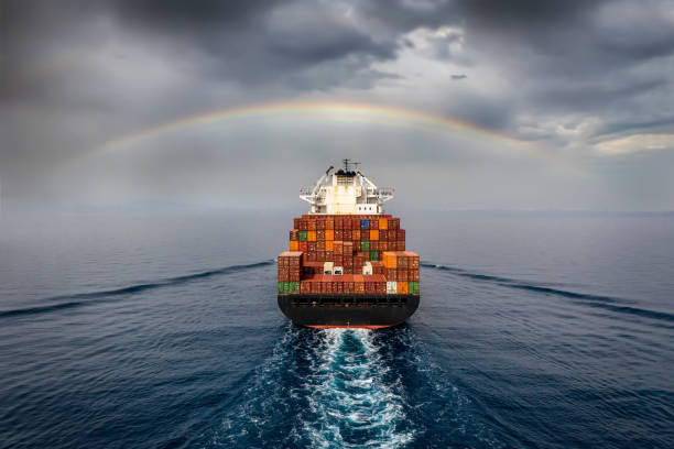 Aerial view of a container cargo ship sailing into bad weather