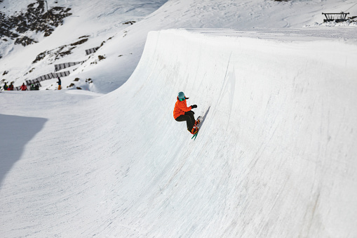 Hidden Valley Highlands Ski Area in Muskoka near Huntsville, Ontario during March Break in March 2022. Staycation in Ontario, Canada. Skiing and snowboarding in Ontario. Canadian mountains. Active Spring Break in Canada. Skiers and snowboarding enjoying the ride in Muskoka mountains