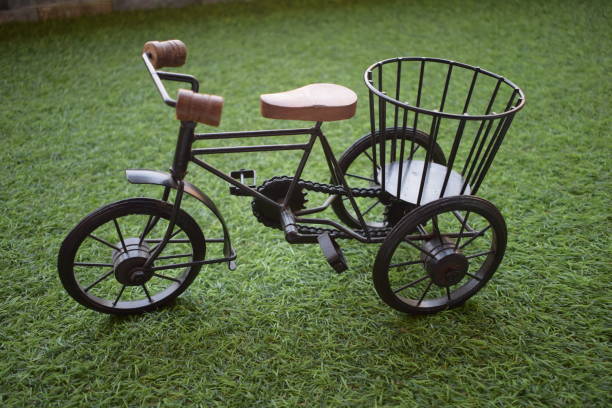 istock Beautiful toy bicycle on green grass 1280113754
