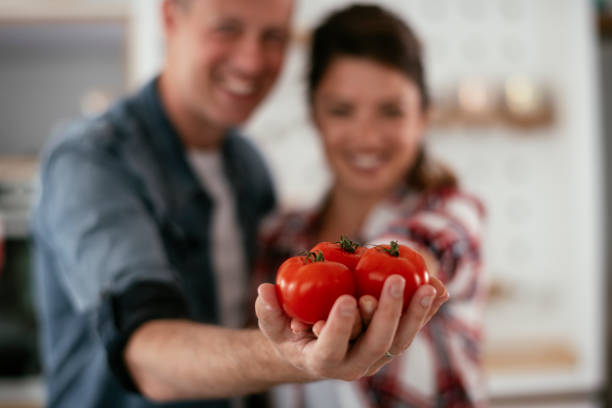 istock Husband and wife making salad. 1280115748