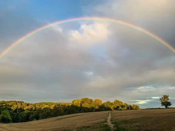 Full rainbow over a field in Wiltshire