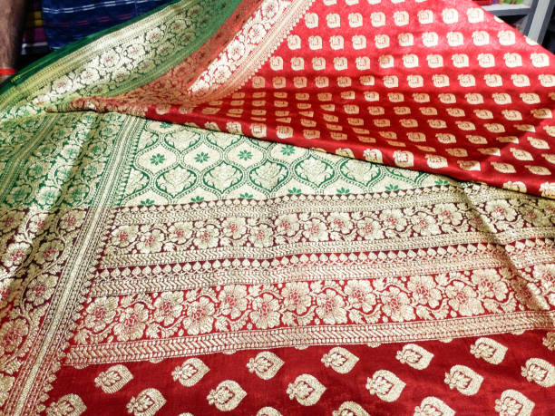 istock A seller displaying Indian sari in a clothing store 1280116916