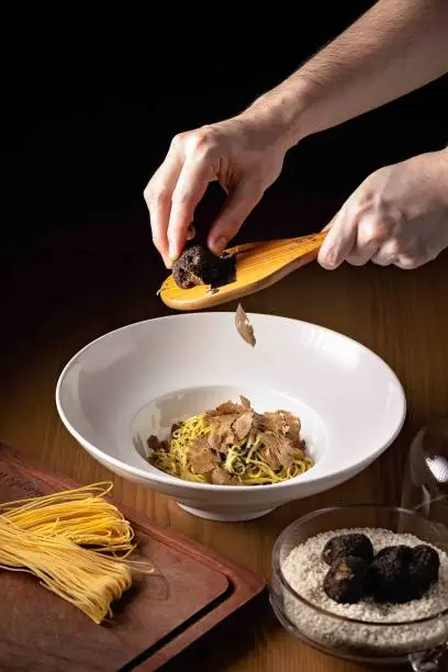 Handmade pasta served with fresh truffles thinly shaved over the dish