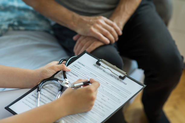 istock Nurse visiting senior man for check up 1280119513