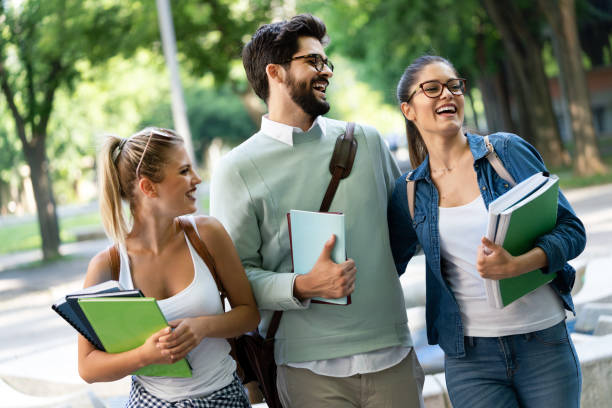istock Group of happy university students studying together and having fun outdoors 1280119779