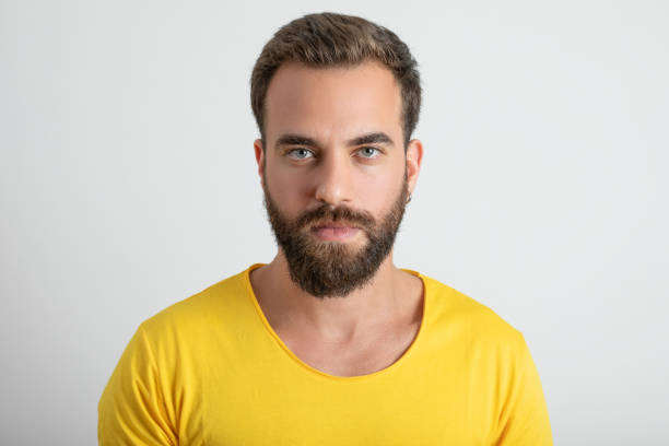 istock Portrait of man looking at camera 1280121175