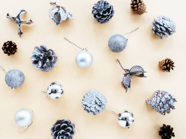 istock Silver Christmas decorations on a yellow background, top view, flat lay 1280121283