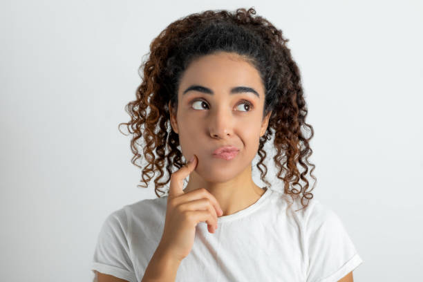 istock Portrait of thinking young woman 1280124594