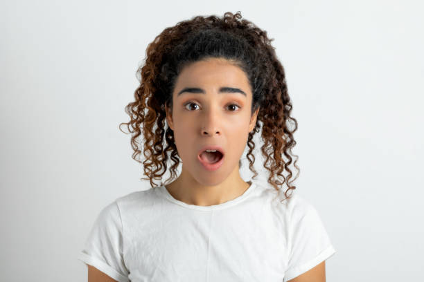 istock Studio portrait of young woman looking at camera 1280124618