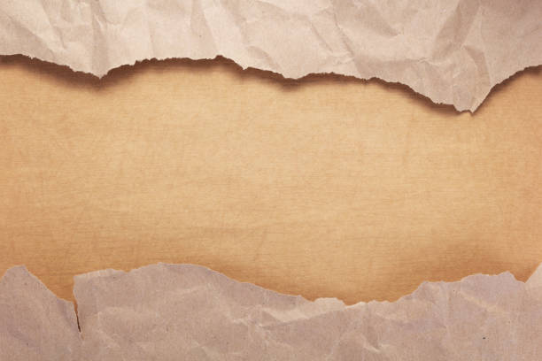 istock wrinkled paper at wooden plank wall or table 1280124662
