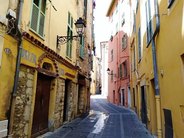 istock Narrow alley amidst buildings 1280125670