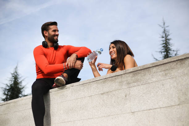 istock A woman and a man train together in nature 1280125696