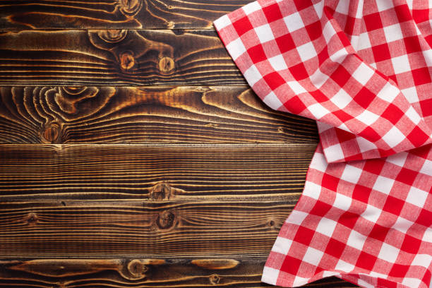 istock cloth napkin or tablecloth at rustic wooden plank board table background 1280128030