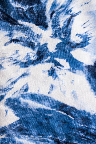 istock Tie-dye cotton fabric texture blue and white paint colors. Ancient resist-dyeing textile coloring technique,trendy cloth 1280128078
