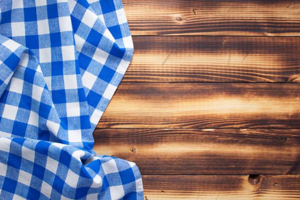 istock cloth napkin or tablecloth at rustic wooden plank board table background 1280128154