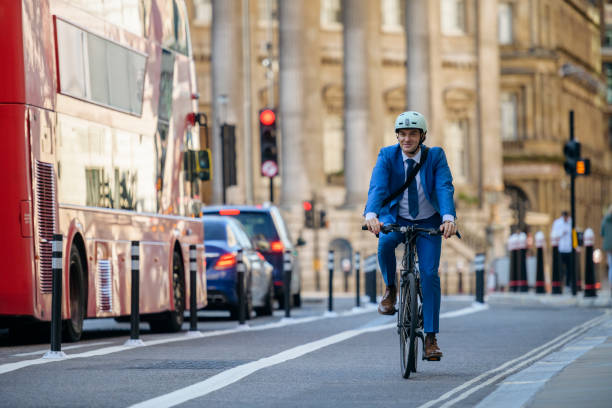 istock Smiling British businessman in early 30s cycling to work 1280128203