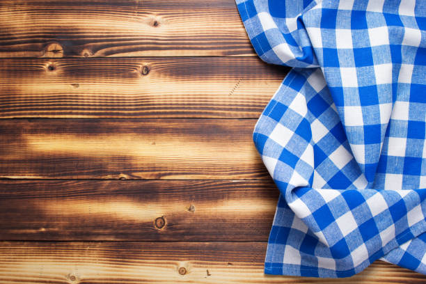 istock cloth napkin or tablecloth at rustic wooden plank board table background 1280128260