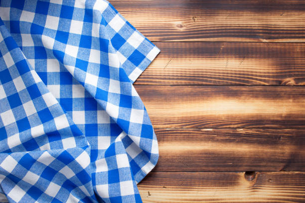 istock cloth napkin or tablecloth at rustic wooden plank board table background 1280128339