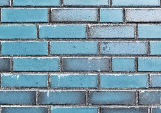 istock Detailed view at a colorful old and weathered brick wall texture as a panoramic background. 1280130237
