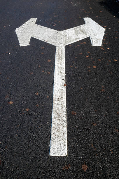 istock white directional arrow in parking lot 1280132207