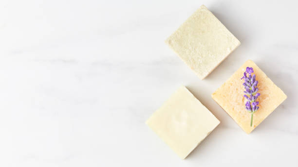istock cosmetics concept panoramic banner. natural eco soap decorated with lavender flower on a marble background. space for text, top view 1280133470