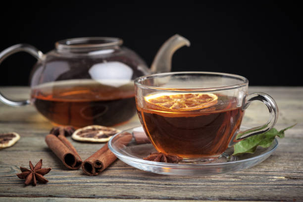 istock aromatic hot cinnamon tea on wooden table. High quality photo 1280133632