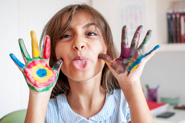 istock Cute girl playing with paints 1280135179