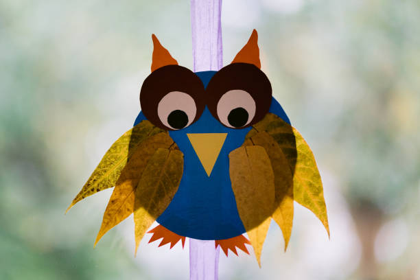 Handcrafted owl made of paper and leaves