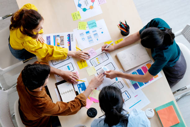 istock Brainstorm planing creative asian teamwork, Group of asia mobile phone app developer team meeting for ideas about screen display prototype smartphone layout, ux startup small business, top view 1280136785