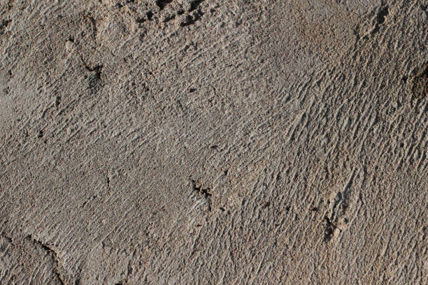 istock Photo of gray natural concrete old wall texture. Grey washed cement surface. Horizontal. 1280136843
