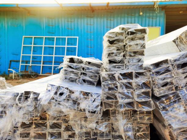 istock Anodized aluminium metal frames wrapped in polythene in a factory 1280139085