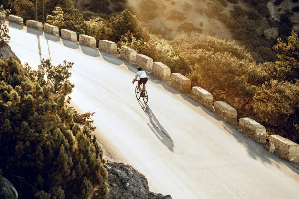 istock Cyclist riding on his bicycle at coastal road 1280140172