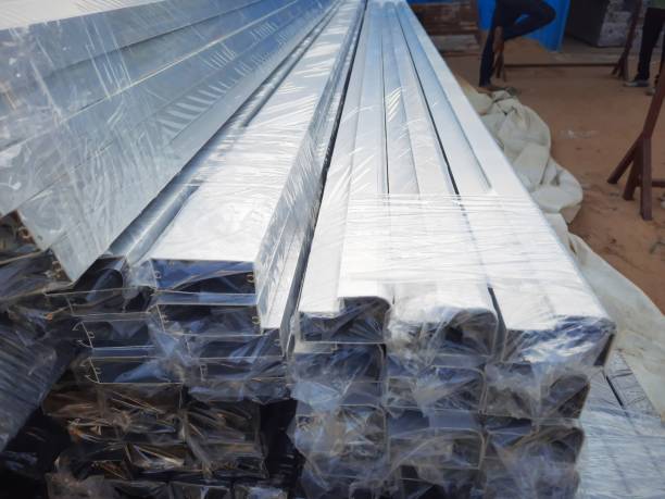 istock Anodized aluminium metal frames wrapped in polythene in a factory 1280140274