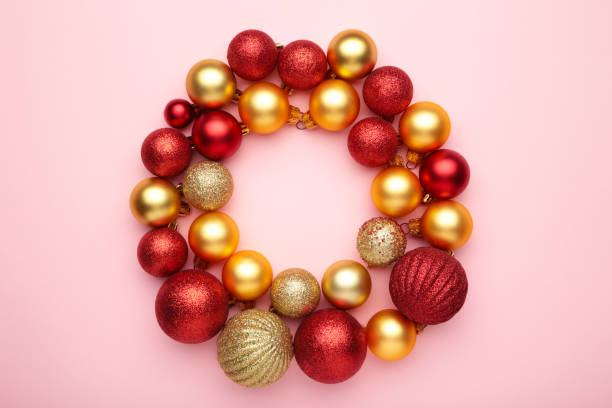 istock Red and gold christmas balls on pink background with copy space. 1280140366