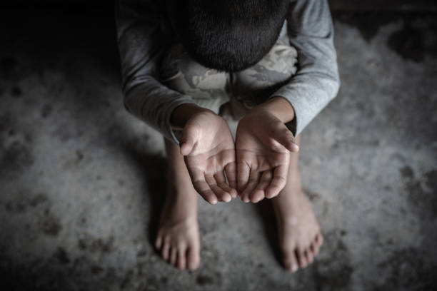 closeup hands poor child begging you for help concept for poverty  people, Human Rights. closeup hands poor child begging you for help concept for poverty  people, Human Rights. poverty stock pictures, royalty-free photos & images