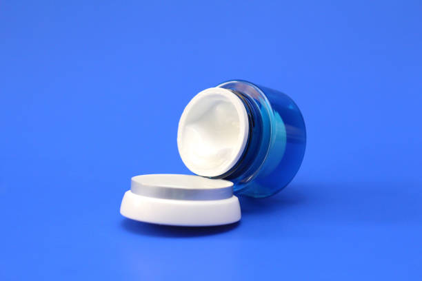 istock Opened cosmetic cream in a blue jar. Anti-aging cream. 1280140649