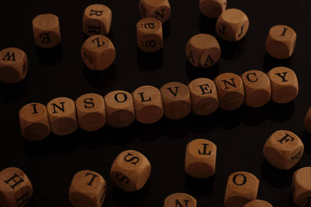 Wooden blocks with the word Insolvency stock photo