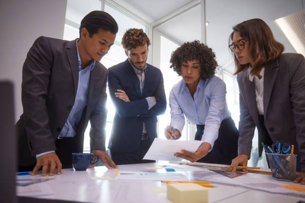 istock Group of business people planning presentation in office 1280147571