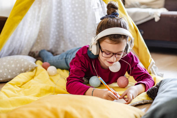 istock Young girl is learning at home on the floor 1280149610