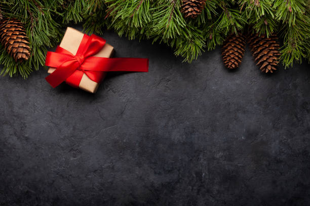 istock Christmas greeting card with fir tree and gift box 1280150088