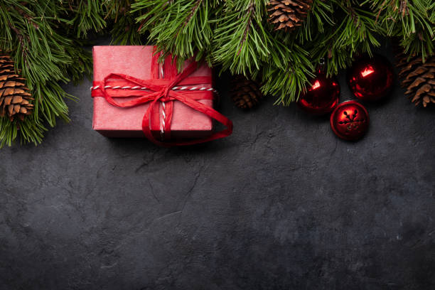 istock Christmas greeting card with fir tree and gift box 1280150103