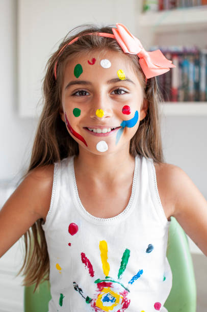 istock Cute girl playing with paints 1280151084