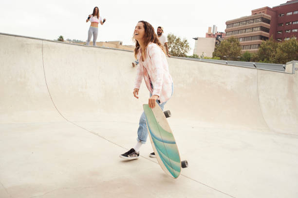 Young people having great time at the skate park