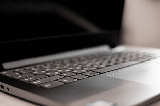 istock Thin Laptop On Office Desk. Out of focus. Blurred 1280152701