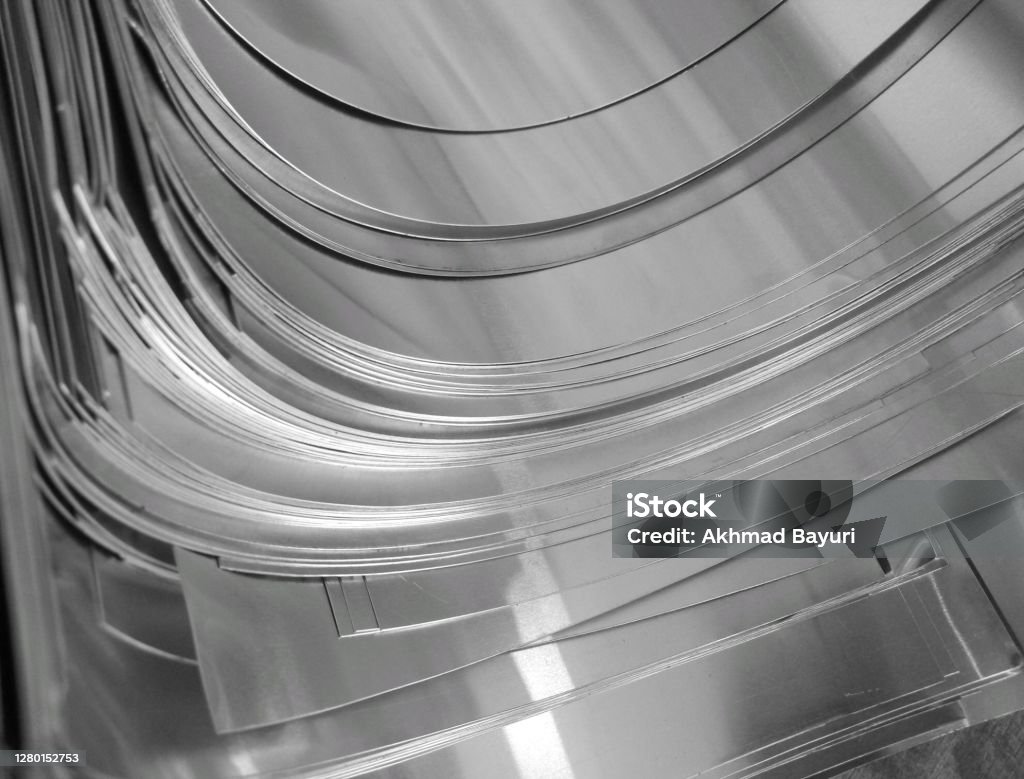 thin silver metal pieces Silver Color Thin Aluminum Metal Pieces That Stacked On Each Other In Metal Based Craft Industry Aluminum Sheet Stock Photo