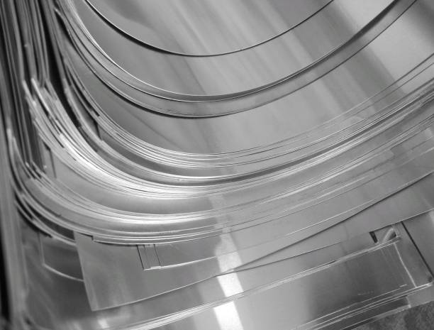 thin silver metal pieces Silver Color Thin Aluminum Metal Pieces That Stacked On Each Other In Metal Based Craft Industry sheet metal photos stock pictures, royalty-free photos & images