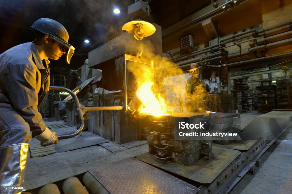 Foundry Working Workers In A Foundry Casting A Metal Workpiece Safety At Work And ...