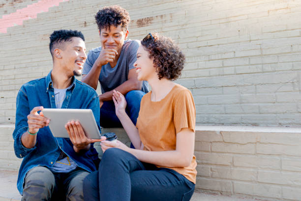 istock Friends gathered on staircase to chat 1280155672